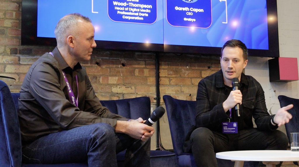 A picture of Gareth Capon, Grabyo CEO, and Lewis Wood-Thompson, Head of Digital Media at PDC, speaking at Grabyo Spotlight London 2023