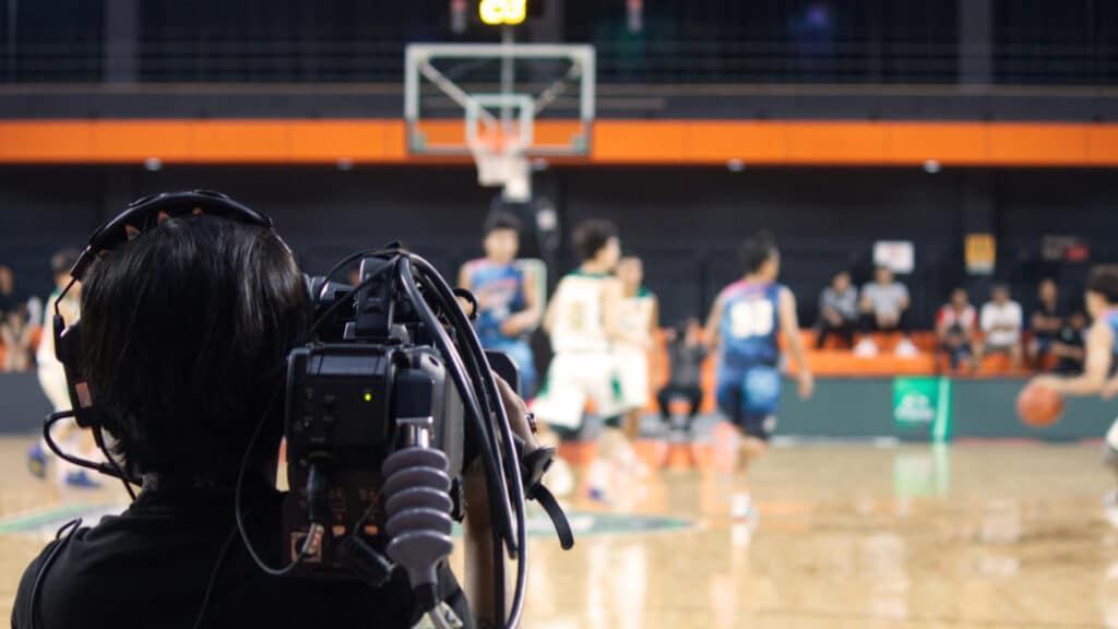 a live cloud production cameraman shooting a basketball game